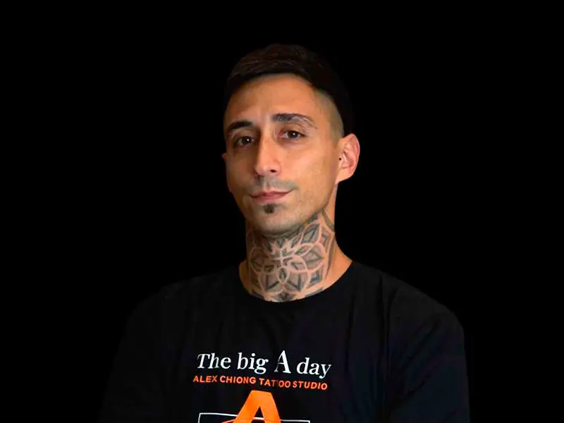 Studio portrait of Sebastián Santostefano on black background.