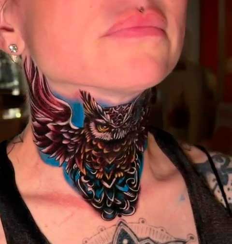 Black and gray tattoo with a color detail on the neck